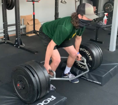 Man Lifting the Weight in Gym