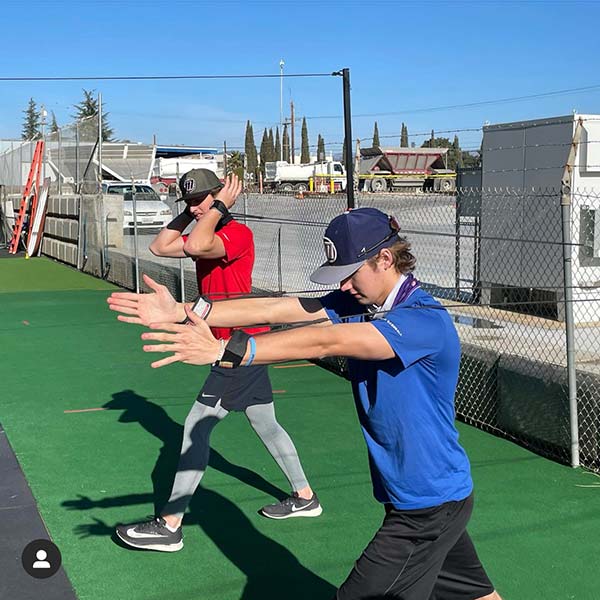 2 boys doing exercises in the outdoor